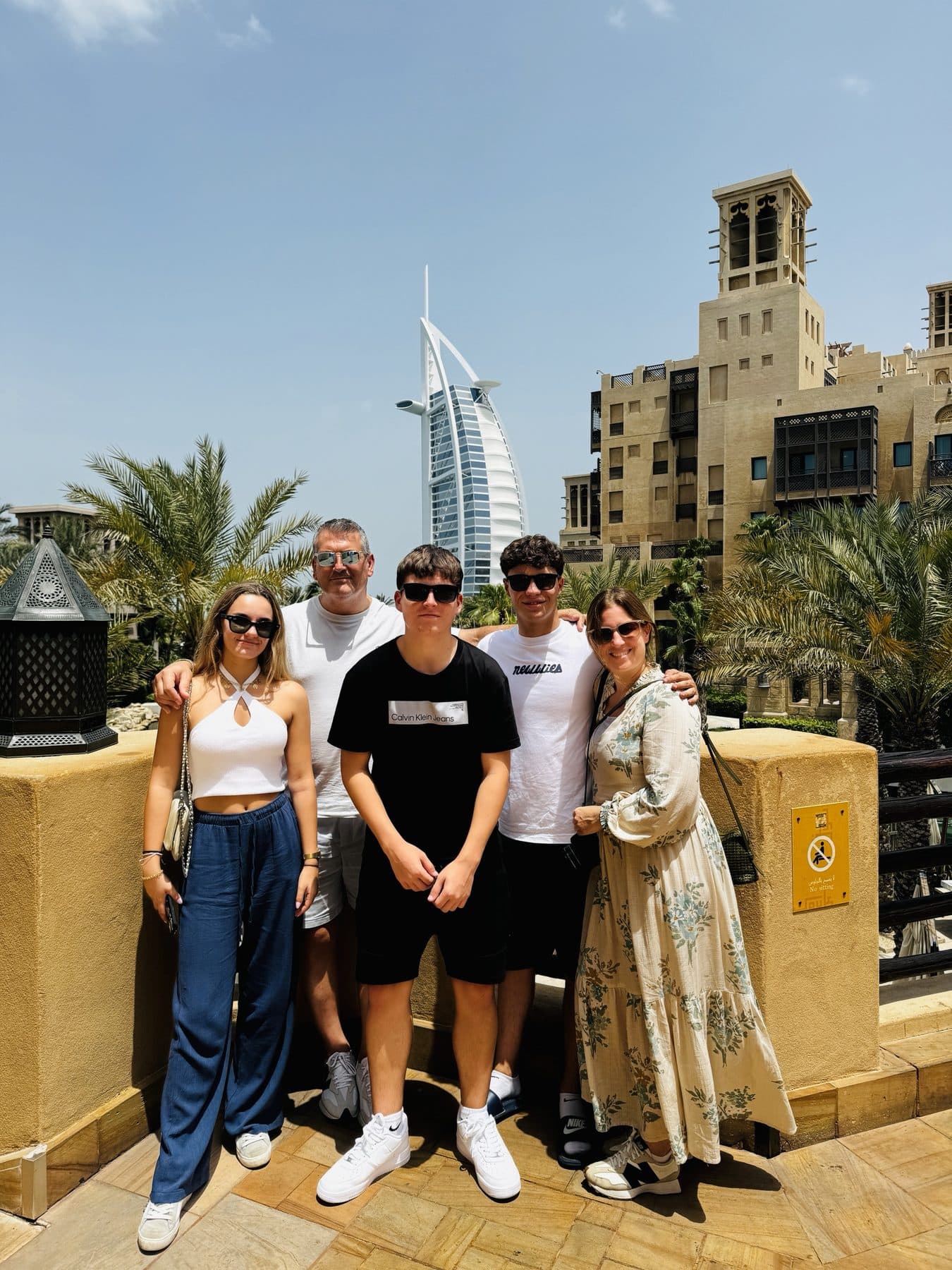 Guests at Madinat Jumeirah with Burj Al Arab during a private Dubai tour