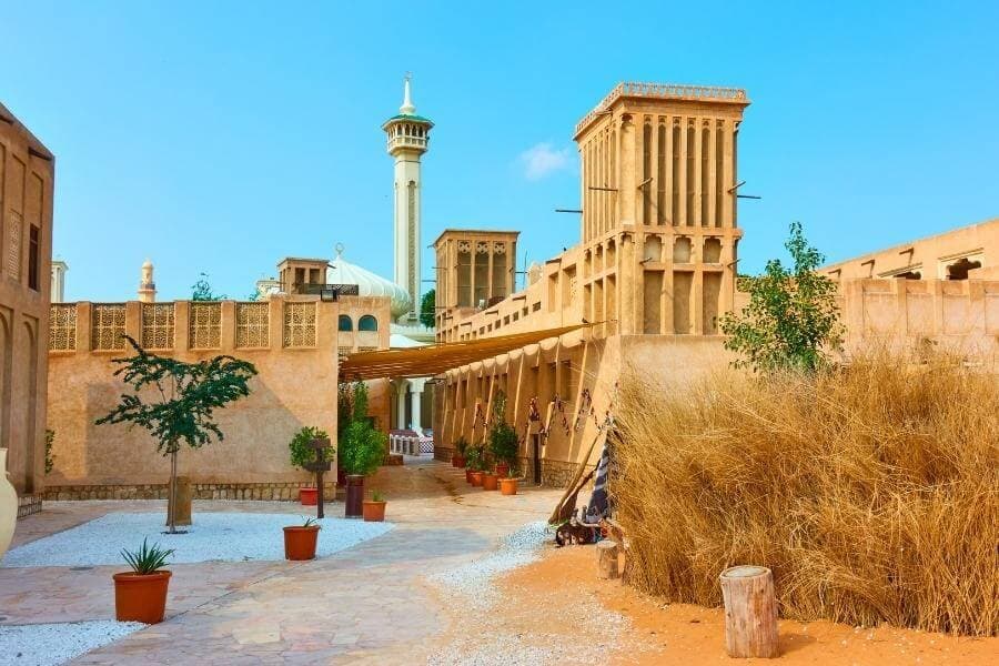 Wind towers around a sandy courtyard in Al Fahidi Historical Neighbourhood, Old Dubai